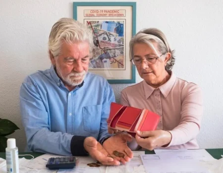 Senior couple reviewing insurance options for their 60s and 70s.