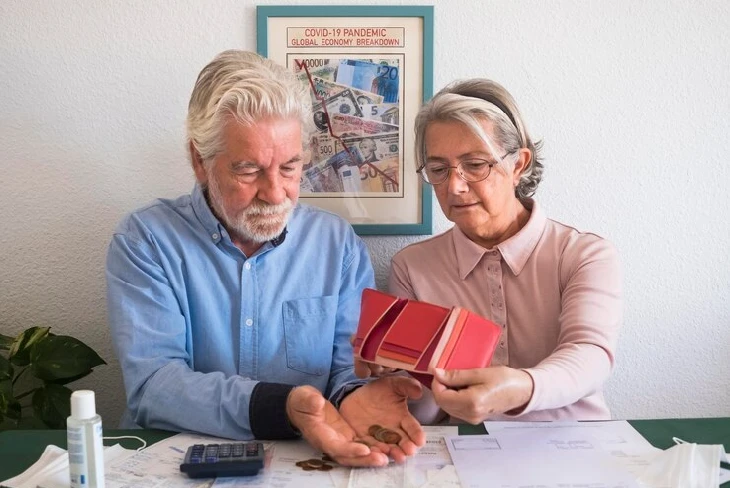 Senior couple reviewing insurance options for their 60s and 70s.